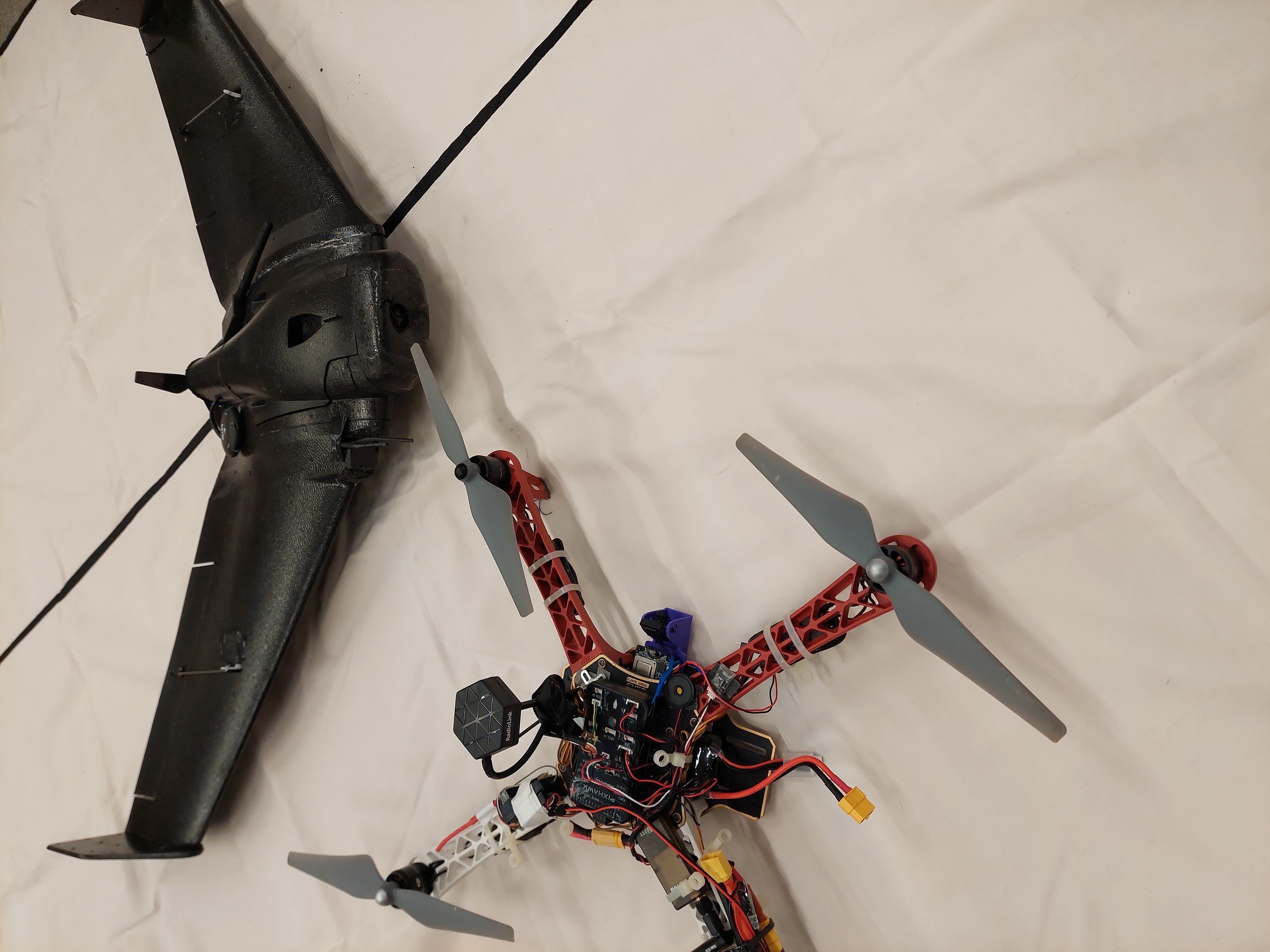 A quadrotor and a plane, the vehicles used in this project